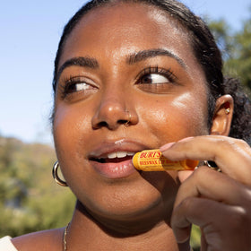 Burt's Bees Beeswax Lip Balm packaging with natural ingredients listed