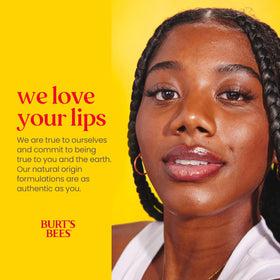 Burt's Bees Beeswax Lip Balm tubes arranged on a wooden surface