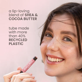 Burt's Bees Lip Shimmer Fig with natural ingredients background