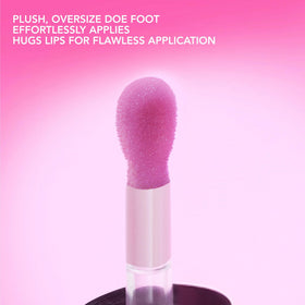 Buxom Full-On Glossy Lip Oil Dolly in beauty setup