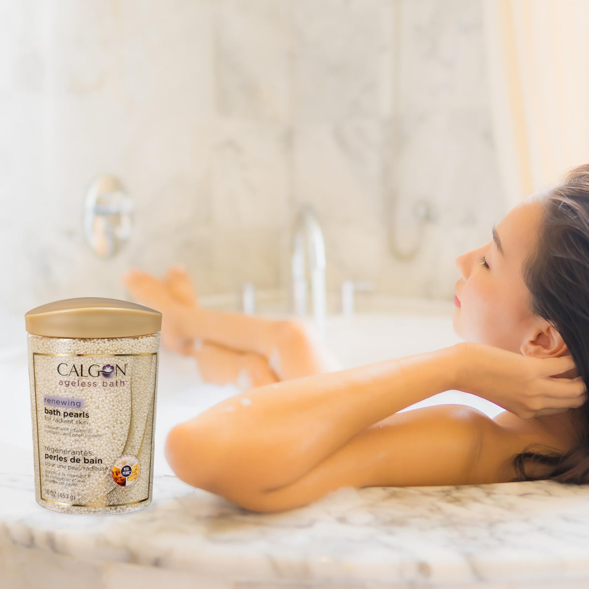 Calgon Ageless Bath Renewing Pearls 16 oz pouring into bath