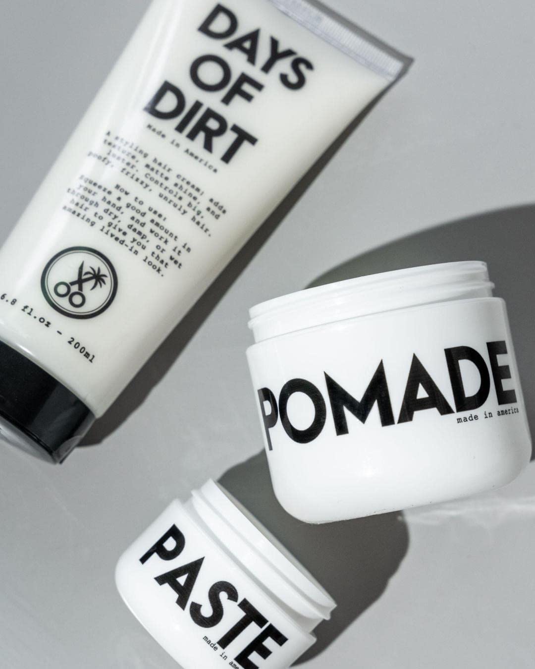 California Born Days of Dirt Hair Styling Cream on a bathroom shelf
