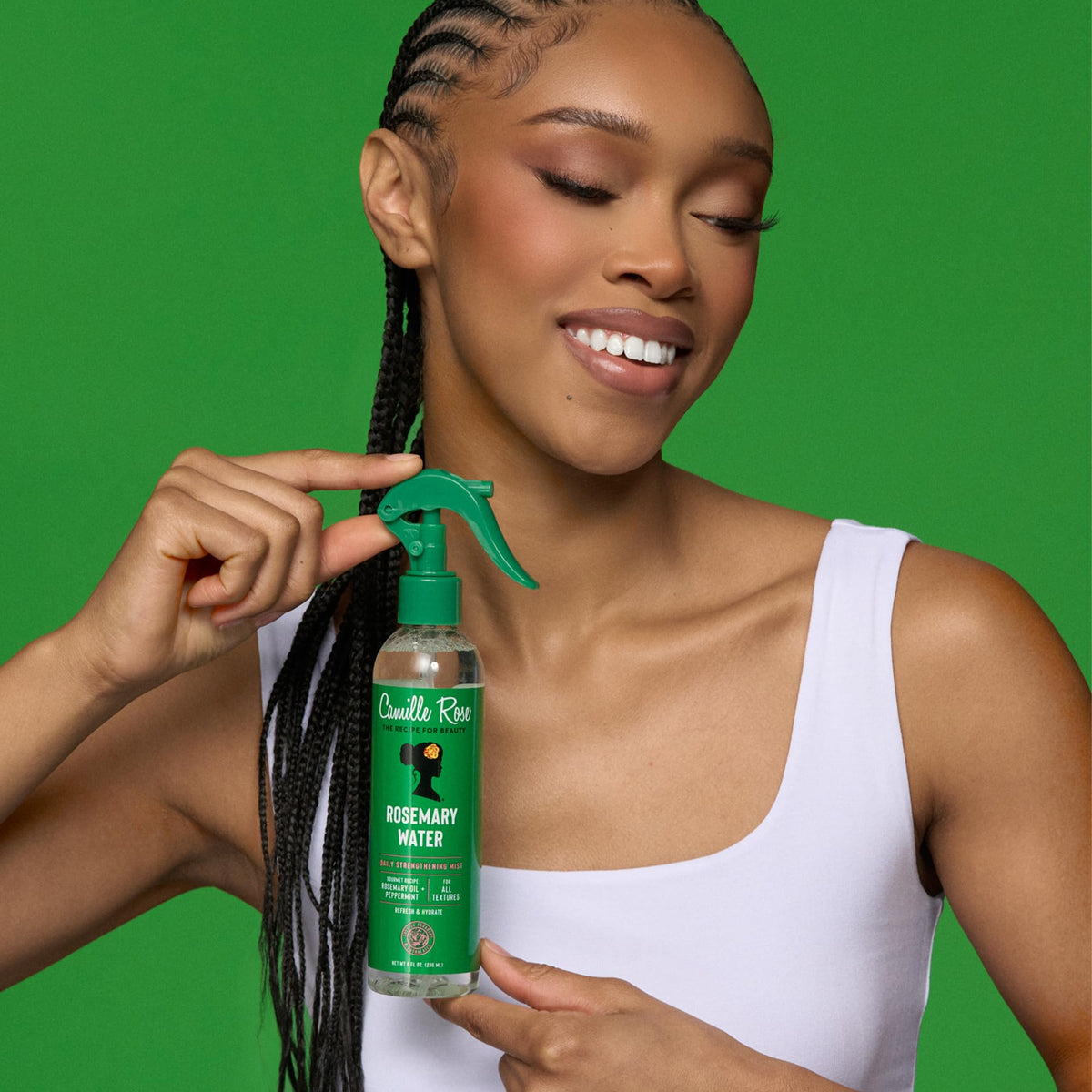Camille Rose Rosemary Water Daily Hair Strengthening Mist in lifestyle setting