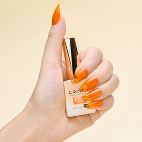 CANNI Jelly Orange Gel Nail Polish on a manicure table