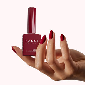 CANNI Red Gel Nail Polish curing under UV lamp