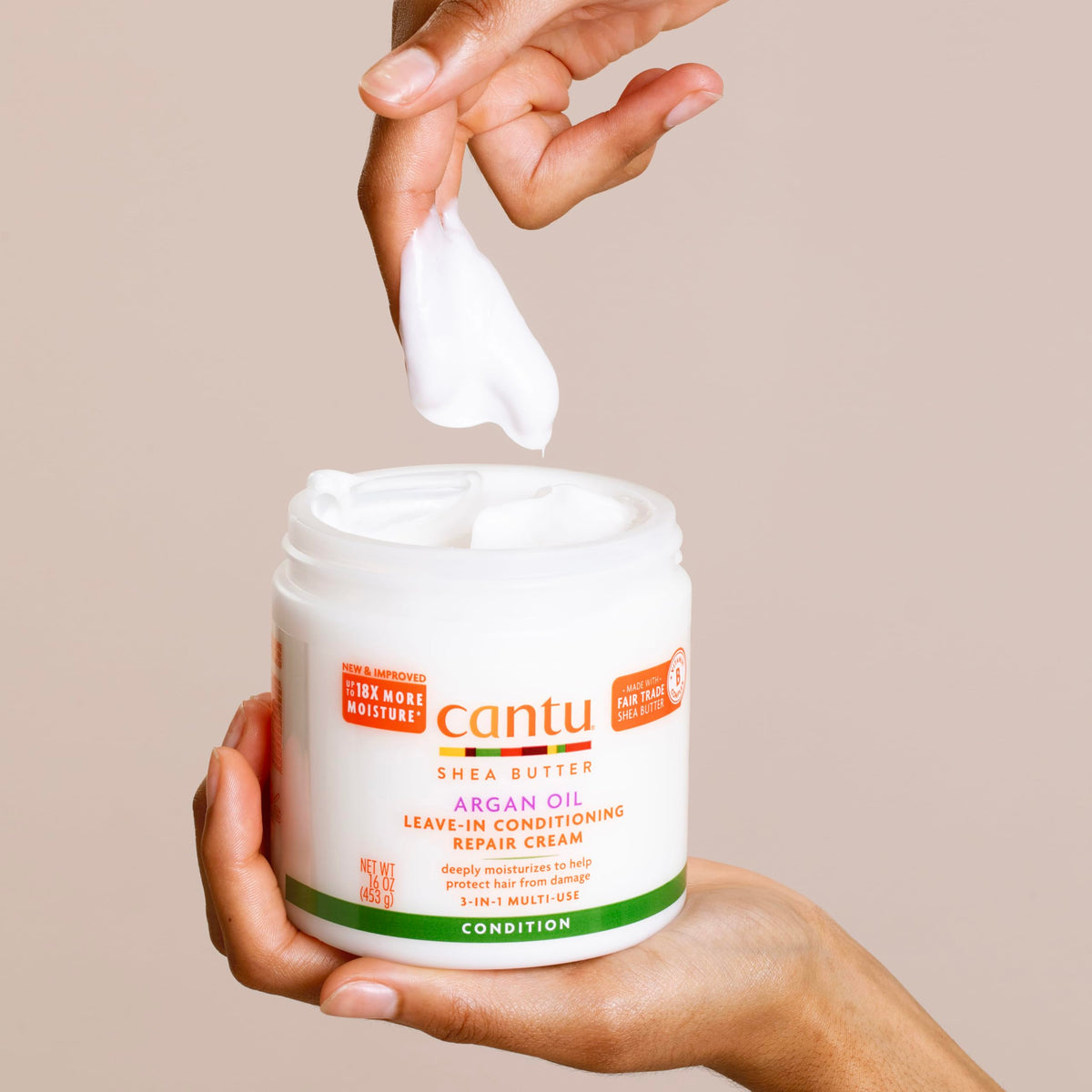 Cantu Argan Oil Leave-In Conditioning Repair Cream 16oz in a bathroom setting