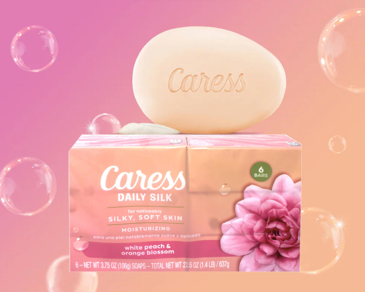Caress Daily Silk Moisturizing Soap bars on a wooden surface