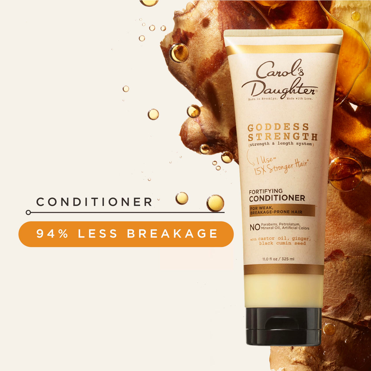 Carol's Daughter Goddess Strength Conditioner being applied to curly hair