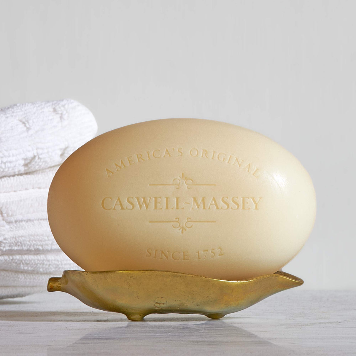Caswell-Massey Number Six Natural Bar Soap on a bathroom counter