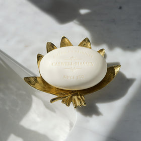 Caswell-Massey soap bars arranged beautifully on a wooden surface
