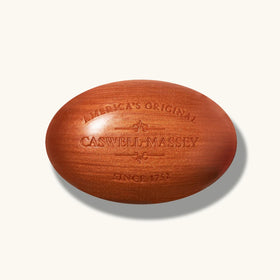 Caswell-Massey Woodgrain Sandalwood Soap on a soap dish