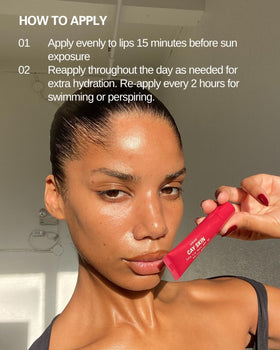 Cay Skin Isle Lip Balm SPF 30 on a table with a beach background