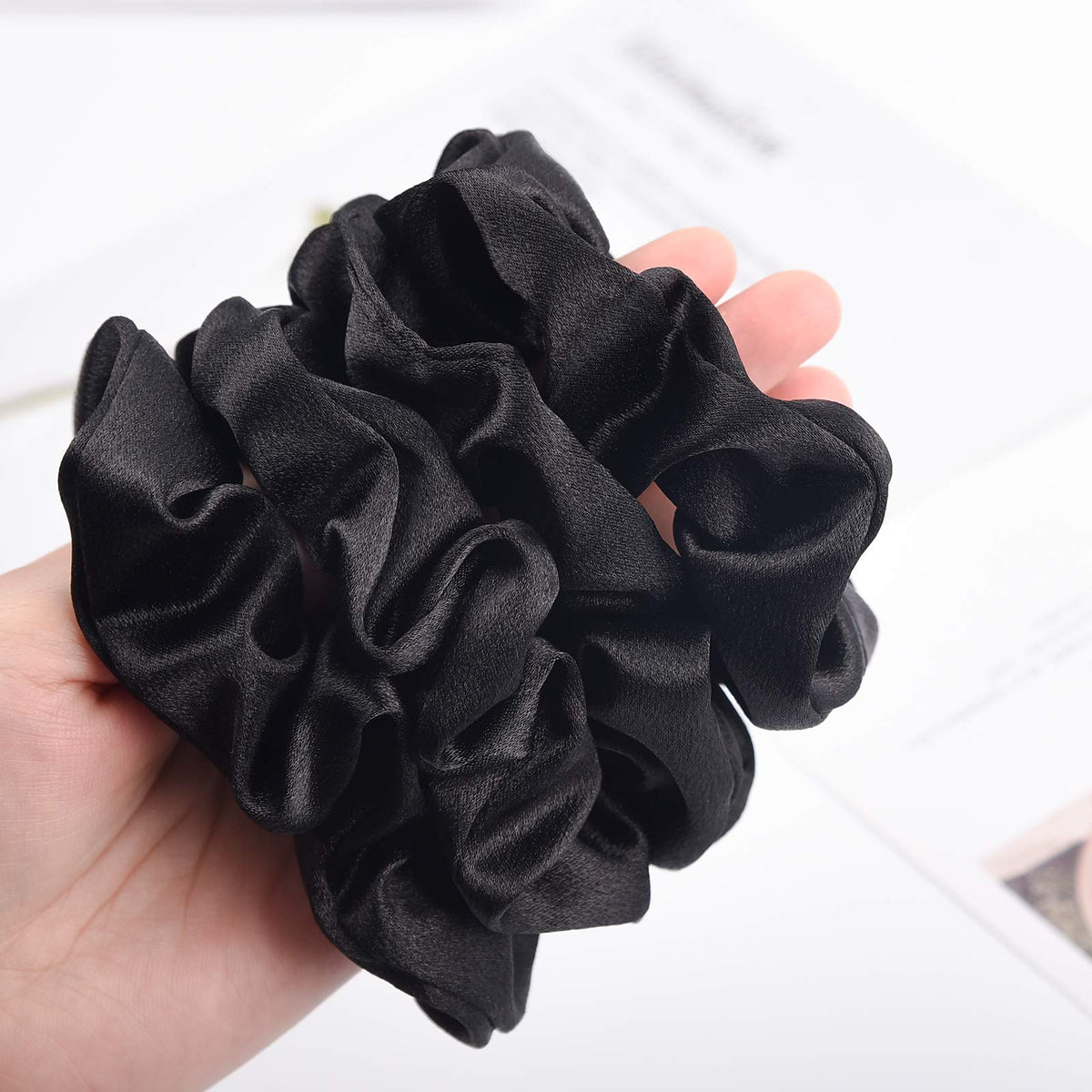CEELGON Black Satin Silk Scrunchies wrapped around a ponytail