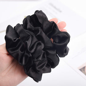 CEELGON Black Satin Silk Scrunchies wrapped around a ponytail