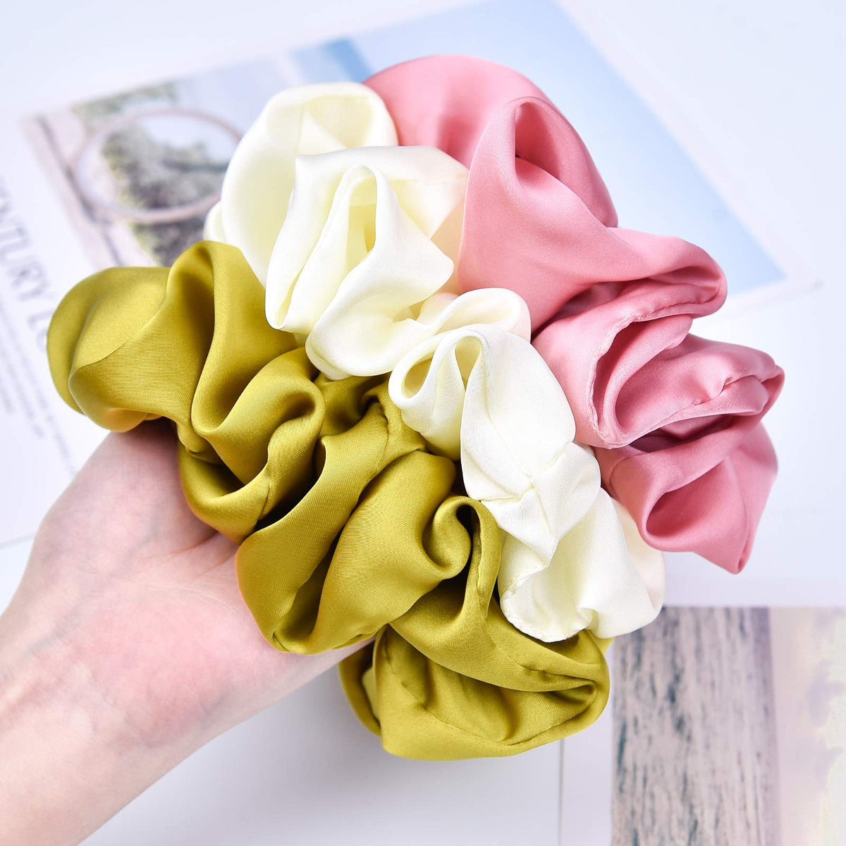 CEELGON large silk scrunchie in navy blue tied in a ponytail