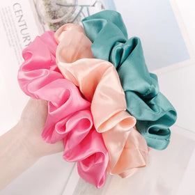 CEELGON scrunchies in a stylish arrangement with hair accessories