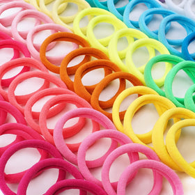 CÉLLOT Elastic Hair Ties in a stylish ponytail
