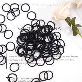 CÉLLOT hair ties scattered on a colourful background