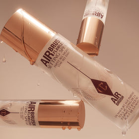 Charlotte Tilbury Airbrush Flawless Setting Spray with makeup products