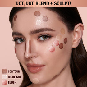 Charlotte Tilbury Beauty Light Wand Peachgasm on model's cheek