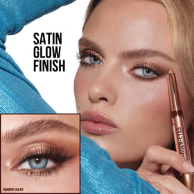 Charlotte Tilbury Exagger-Eyes Easy Eyeshadow Stick being held in hand