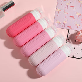 CHEODIN Travel Bottles arranged in a stylish travel setup