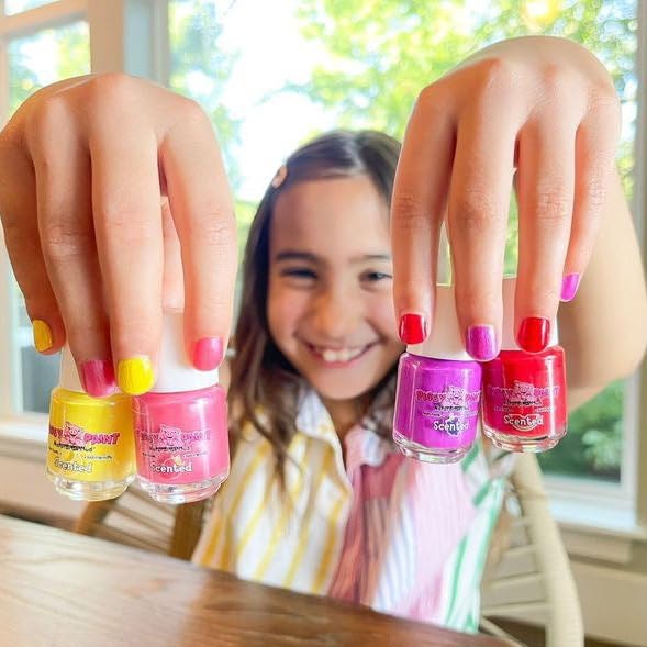 Child applying Piggy Paint Scented Nail Polish