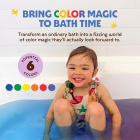 Child enjoying a colourful bath with Honeysticks Bath Color Tablets