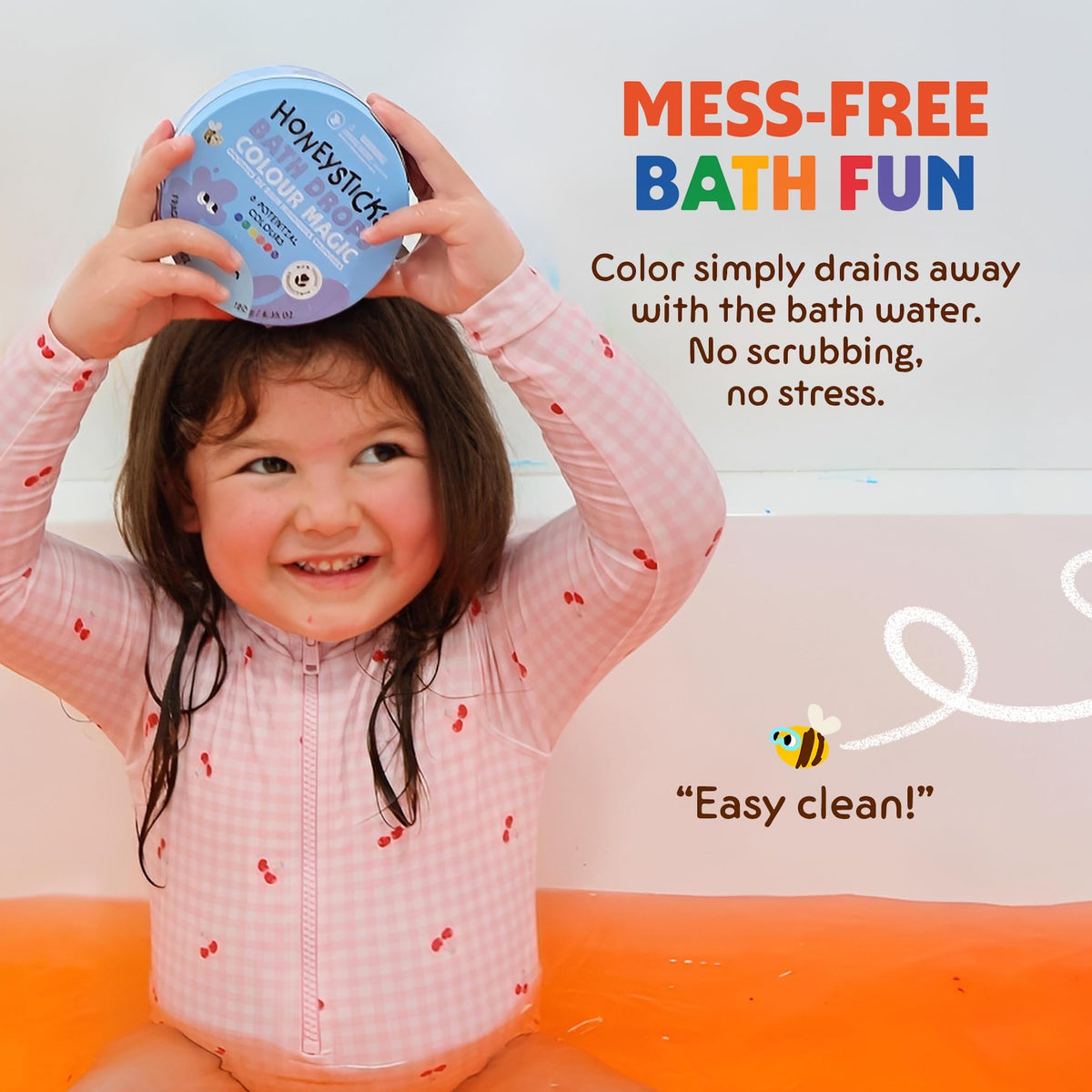 Child mixing colours in the bath with Honeysticks Bath Color Tablets