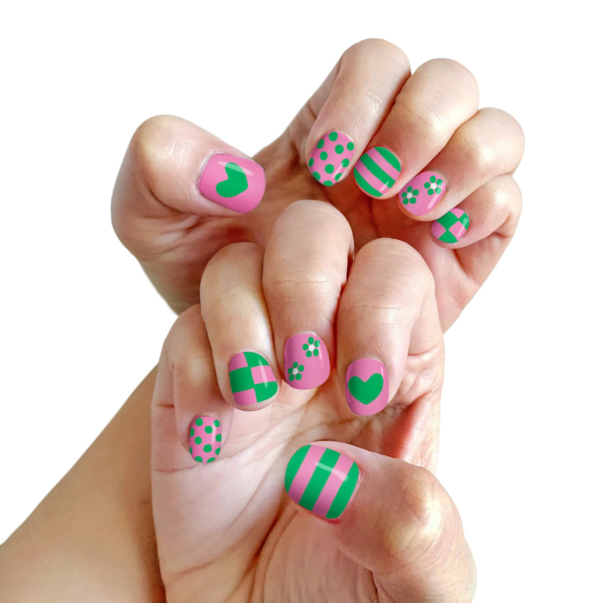 Child showing off colourful nails painted with Piggy Paint
