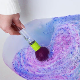 Child using ZIMPLI Baff Bombz Magic Brush in bath