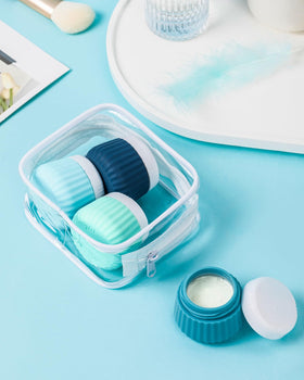 Clear makeup bag holding travel containers