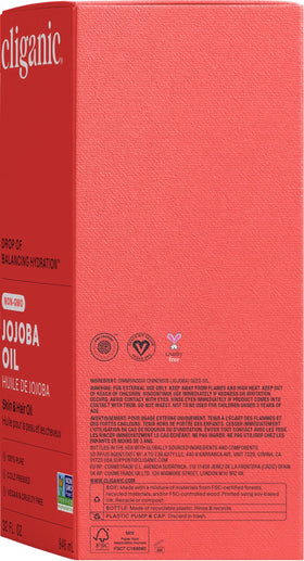 Cliganic Jojoba Oil 32 oz on a vanity with natural decor