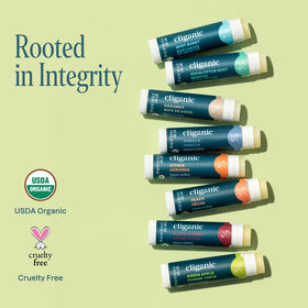 Cliganic Organic Lip Balm in Peach flavour with peaches nearby