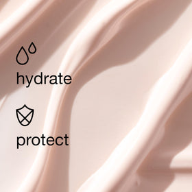 Clinique Moisture Surge SPF 28 on a bathroom counter
