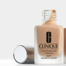 Clinique Superbalanced Oil Free Liquid Foundation with applicator on a vanity