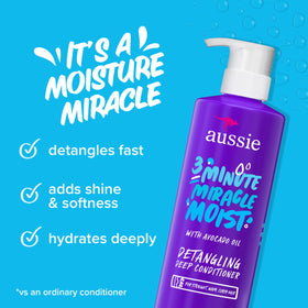 Close-up of Aussie 3 Minute Miracle Moist Deep Conditioner bottle with avocado oil
