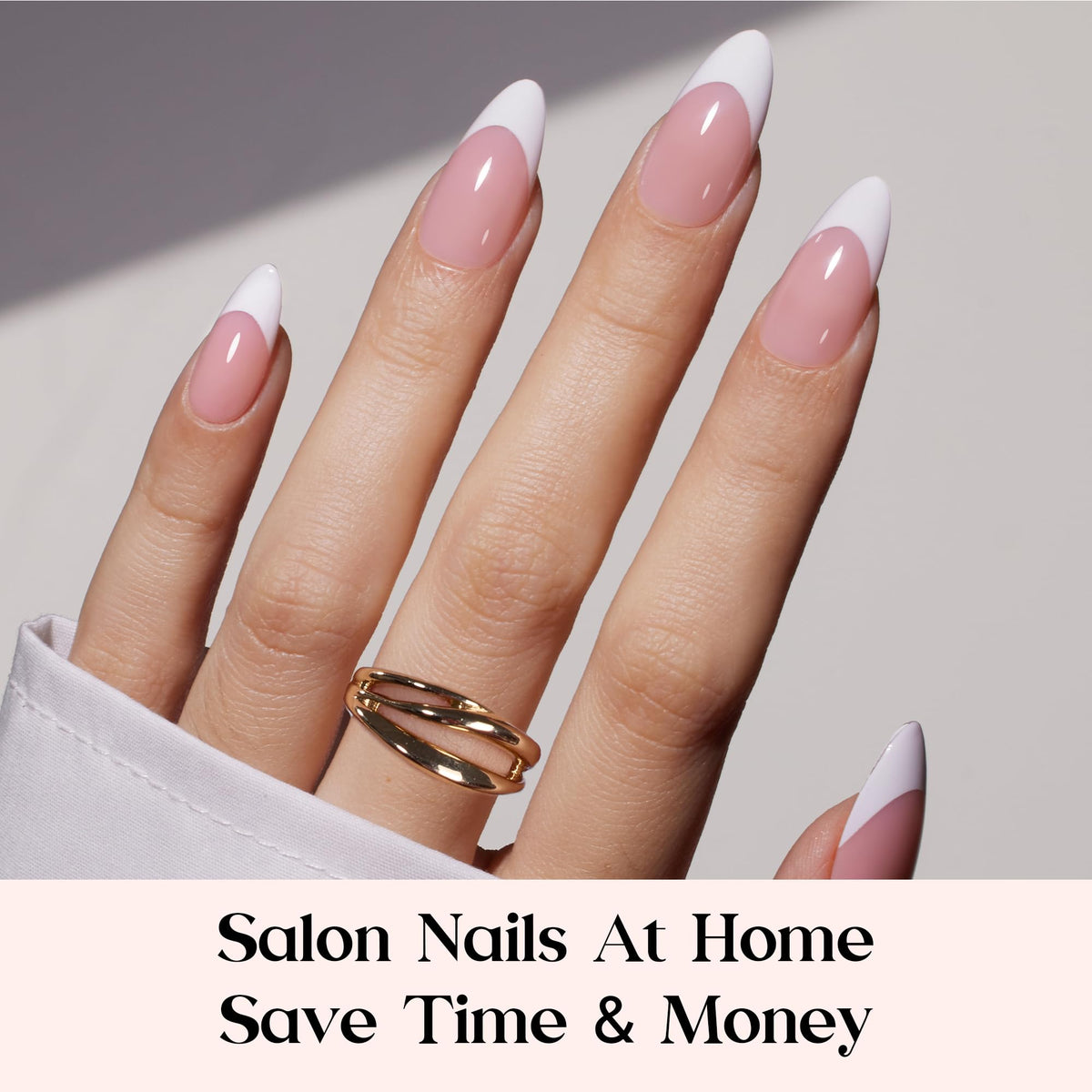 Close-up of Beetles medium almond nails with pink and white design