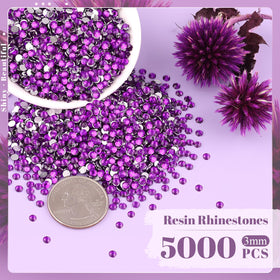 Close-up of BELLEBOOST dark purple rhinestones with tweezers
