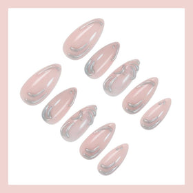 Close-up of BLGTGH Almond Press on Nails showing design details