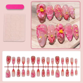 Close-up of BLGTGH Press On Nails showing flower charm detail
