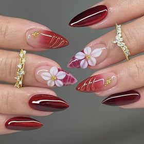 Close-up of BLGTGH Red Press on Nails showing ombre design