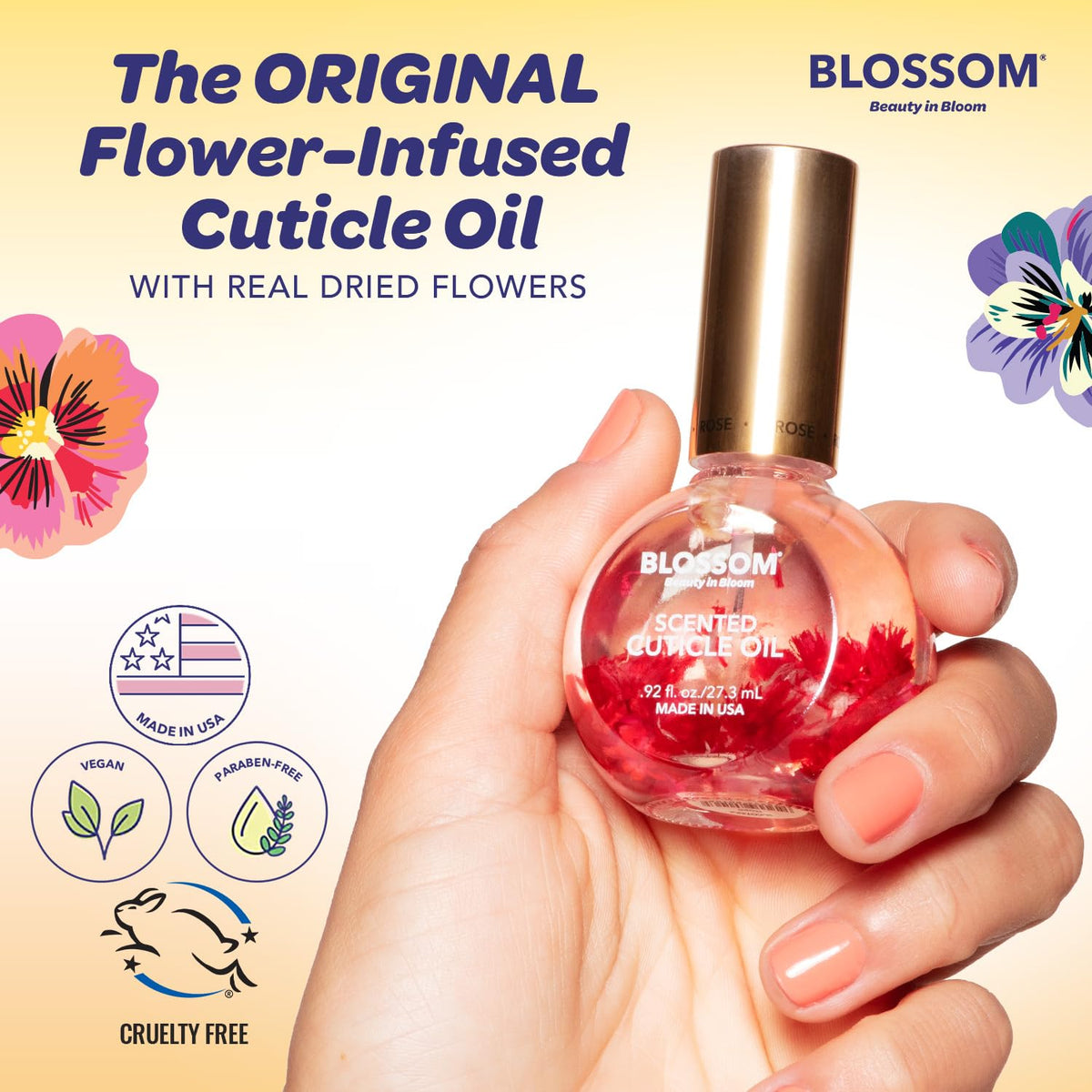 Close-up of Blossom Cuticle Oil with dried flowers inside