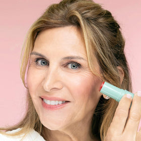 Close-up of BOOM! Parisian Red Cream Blush Stick showing creamy texture
