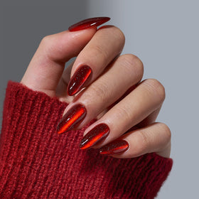 Close-up of BTArtbox Mystic Ruby Press On Nails showing dark red cat eye effect