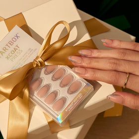 Close-up of BTArtbox Press On Nails Sliver Bells in various sizes