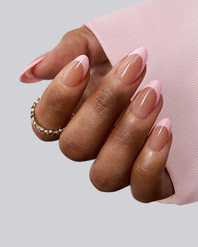 Close-up of BTARTBOXNAILS Pink French Tip Press On Nails showing almond shape