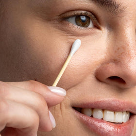 Close-up of Cliganic organic cotton swab with paper stick
