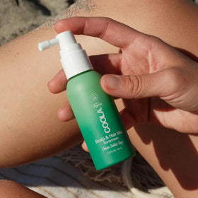 Close-up of COOLA Organic Scalp Spray ingredients list