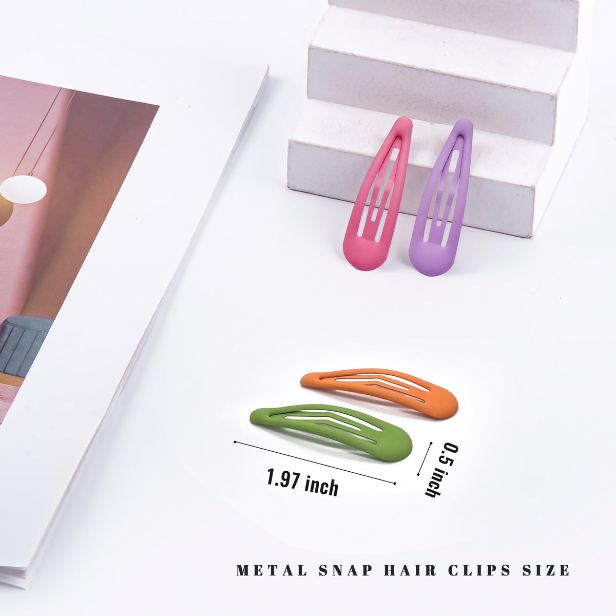 Close-up of Cptots metal snap clip in matte rainbow colour